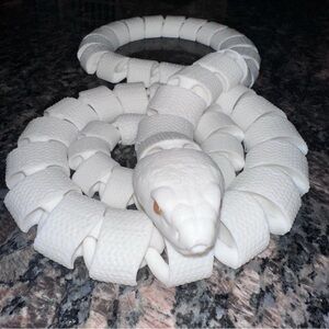 3D printed White snake with yellow eyes
